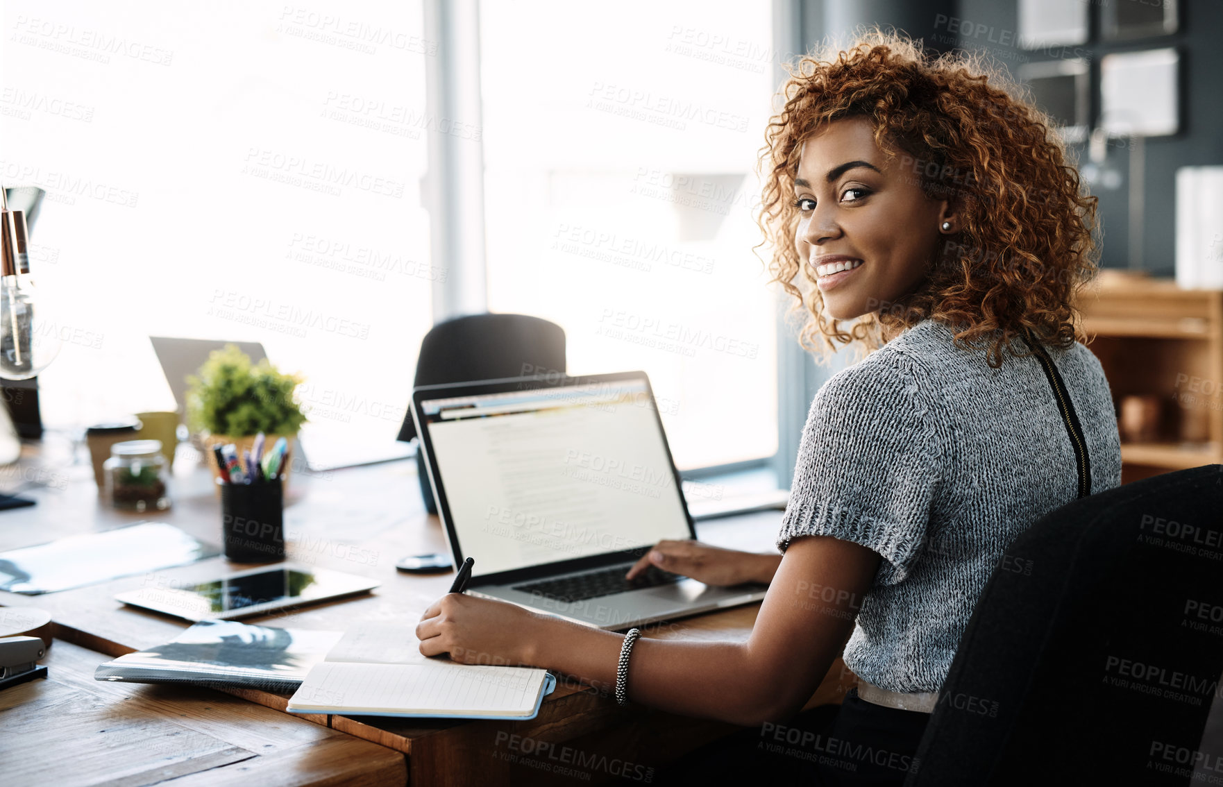 Buy stock photo Portrait of a young businesswoman working in an office