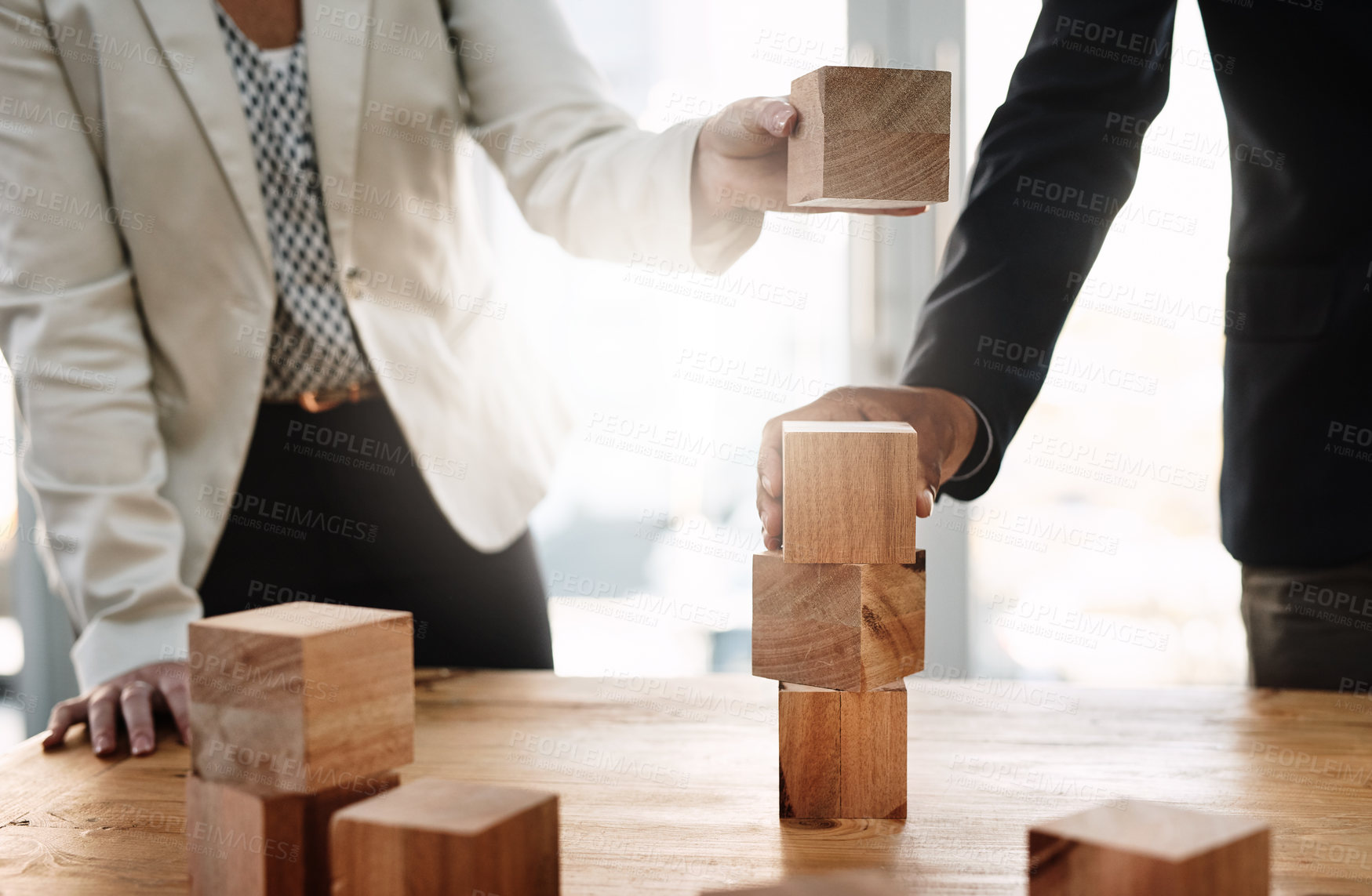 Buy stock photo Hands, wood building blocks and business people in partnership with strategy, problem solving and support. Teamwork, wooden toys and together with puzzle, synergy and mindset for solution in office