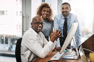 Buy stock photo Portrait of a group of businesspeople working together on a computer in an office