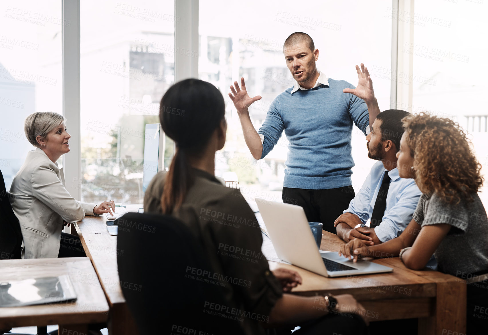 Buy stock photo Businessman, meeting and presentation with team in growth, mission or company vision at office. Group of employees listening to speaker in boardroom for training, project or workplace expansion