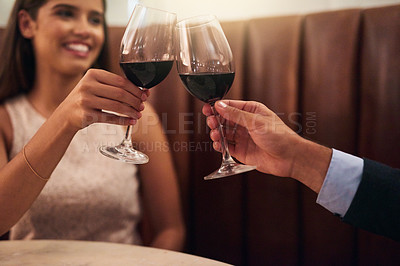 Buy stock photo Love, hands and couple toast in restaurant for achievement, romantic and loving together. Romance, man and woman cheers, fine dining and romance for Valentines day, affection or bonding on date night