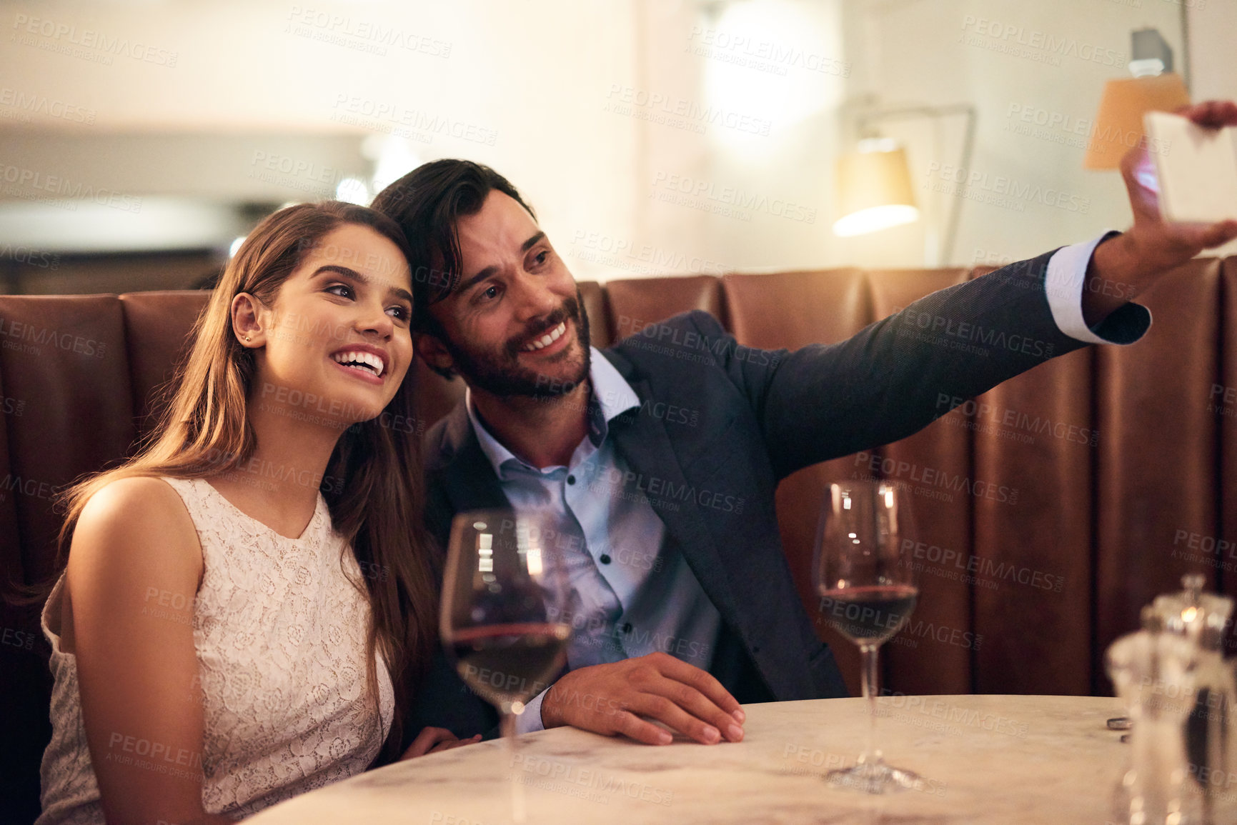 Buy stock photo Selfie, wine and anniversary with a couple in a restaurant for a romantic fine dining celebration of love. Photograph, alcohol or valentines day with a man and woman celebrating a milestone together
