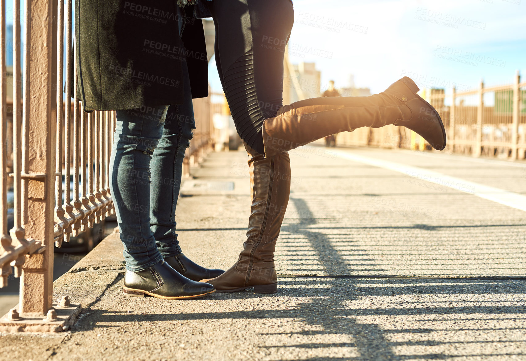 Buy stock photo Couple, legs and tourists in city on vacation, honeymoon adventure and connect on urban street. People, bridge and travel to New York on weekend for love, together and outdoor for footwear on date