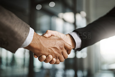 Buy stock photo Closeup of business men giving handshake, hiring an employee and welcoming to a company in a meeting in a modern office together. Corporate professionals making deals, agreements and showing teamwork