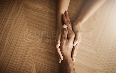 Buy stock photo People, couple and above with holding hands in table for help, care and comfort with support. Trust, empathy and relationship space with wellbeing, wellness and love for kindness, unity or commitment