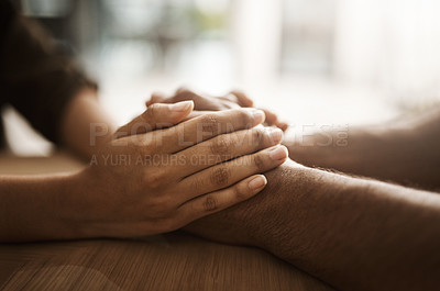 Buy stock photo People, couple and holding hands in desk for support, care and comfort for help at home. Trust, empathy and relationship with wellbeing, wellness and love for kindness, unity and commitment