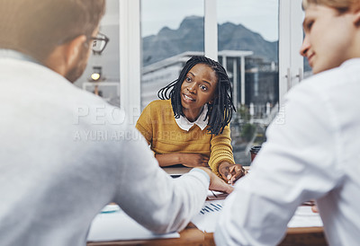 Buy stock photo Cropped shot of a group of businesspeople having a meeting in an office