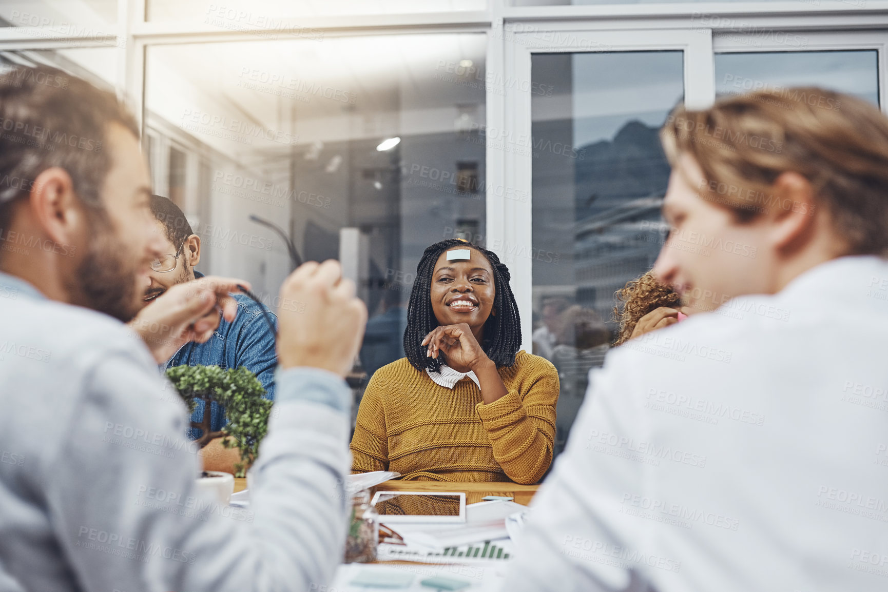 Buy stock photo Cropped shot of a group of businesspeople having a meeting in an office