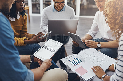 Buy stock photo High angle shot of unrecognizable colleagues having a meeting in the office