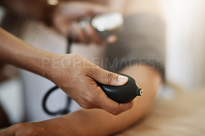 Buy stock photo Closeup shot of an unrecognizable nurse checking a patient's blood pressure