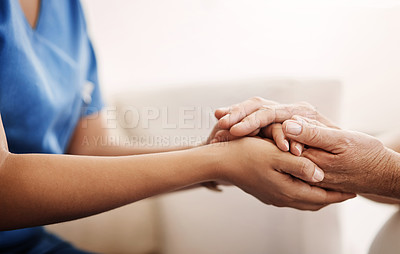 Buy stock photo Cropped shot of an unrecognizable nurse holding a senior woman's hands in comfort