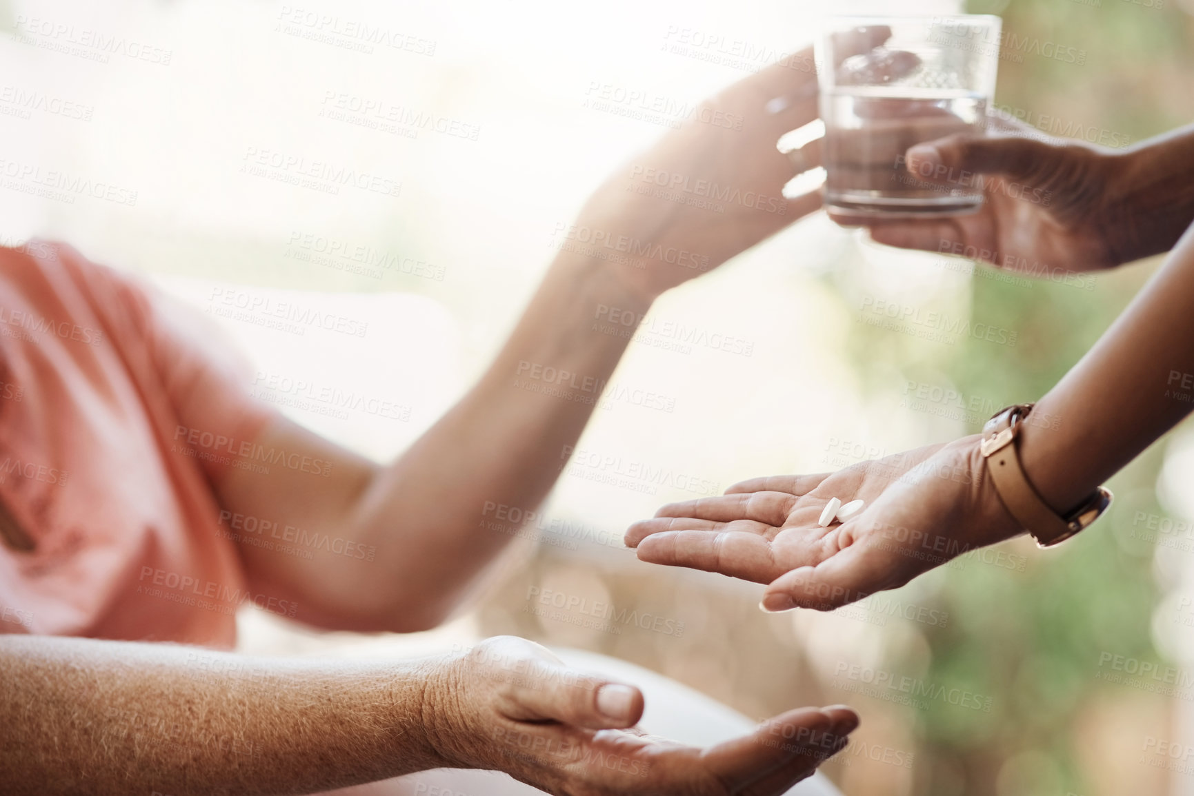 Buy stock photo Hand, woman and medicine with water at nursing home for patient medical treatment, supplements or support of healthcare. People, caregiver and prescription pills, drugs or glass for health diagnosis