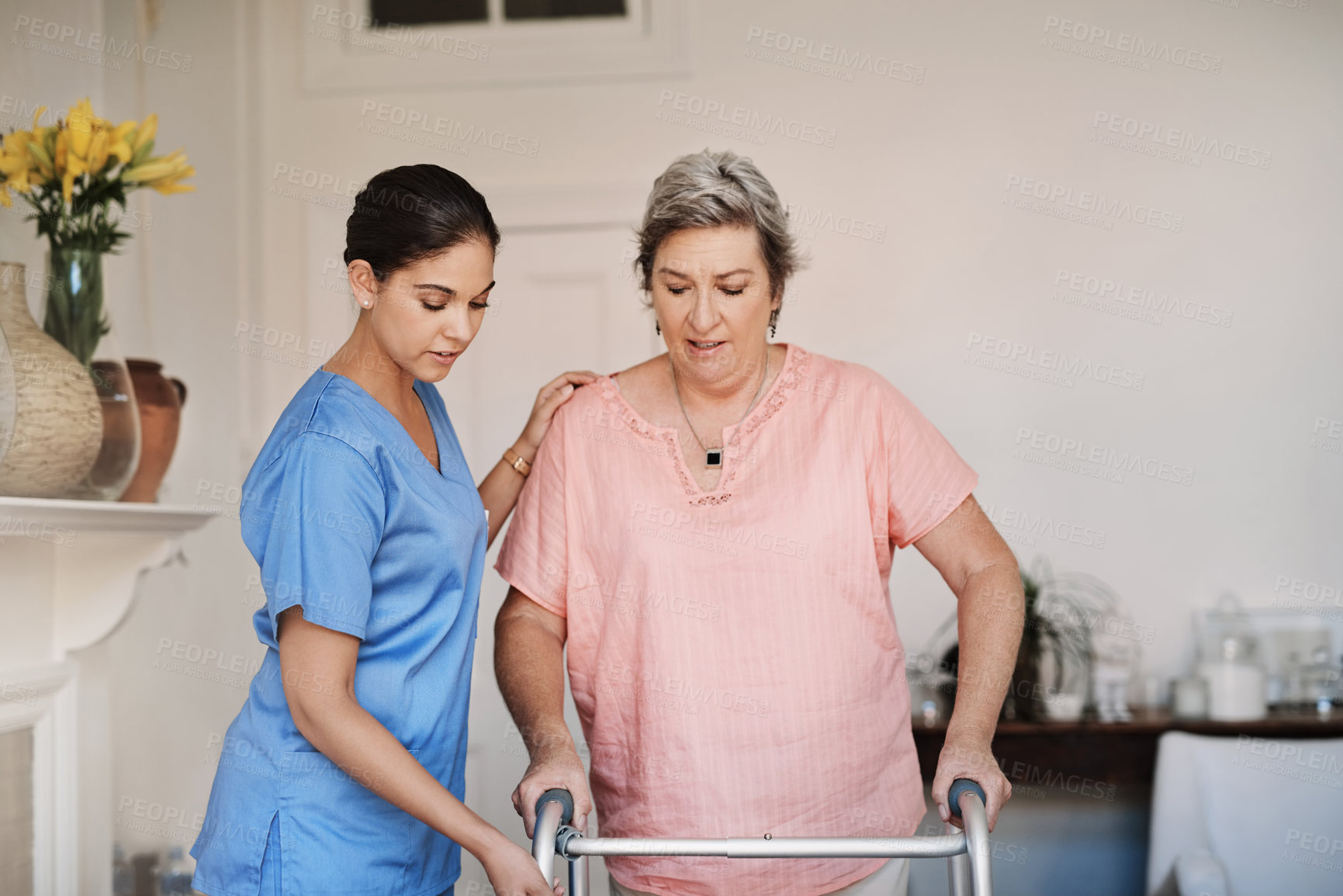 Buy stock photo Caregiver, woman and helping with walker at nursing home for mobility support, physical therapy or hope for healing disability. Nurse, patient and physiotherapy for anatomy, balance or rehabilitation