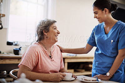 Buy stock photo Woman, smile and caregiver for support in kitchen nursing home breakfast, relax or healthy nutrition advice. Nurse, patient and food for senior care by helping, trust or medical service consulting