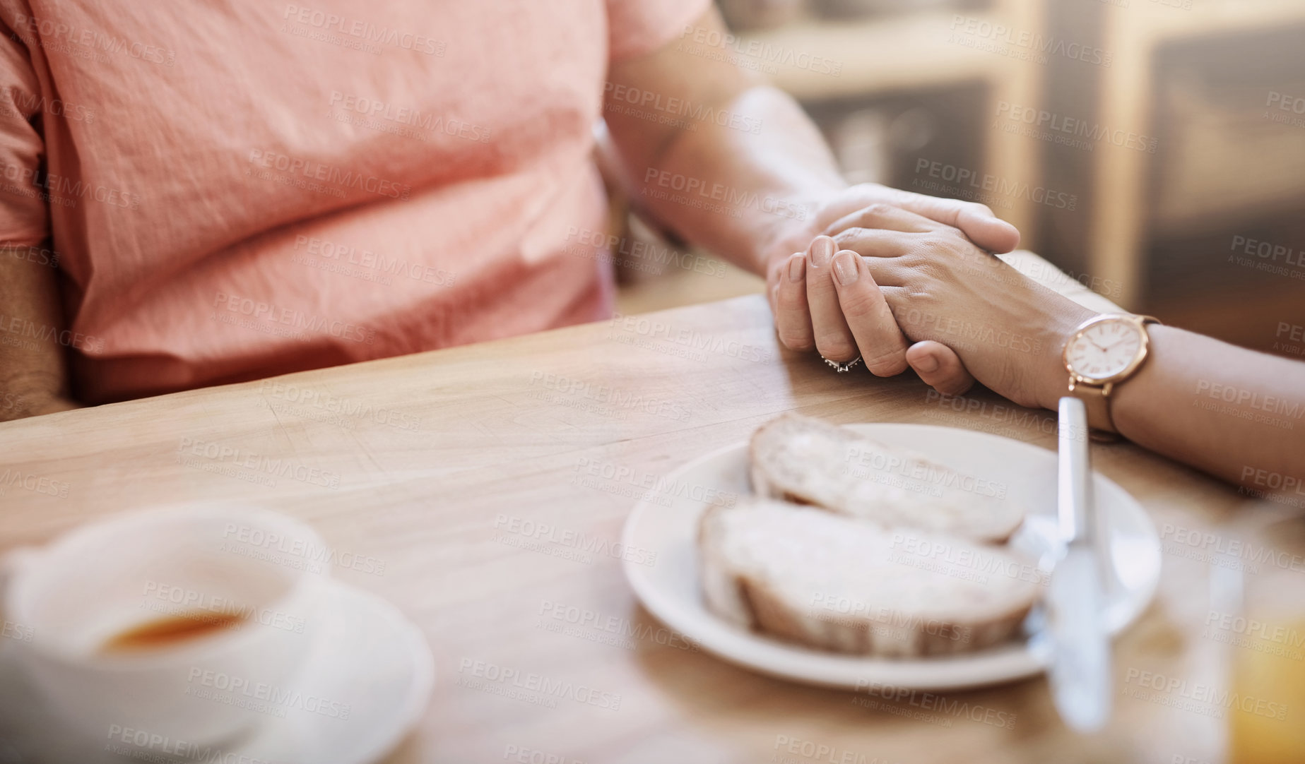 Buy stock photo People, holding hands and trust in nursing home for help, support and hope in living room. Women, comfort and senior care at wooden table for grief counseling, empathy or mental health in retirement