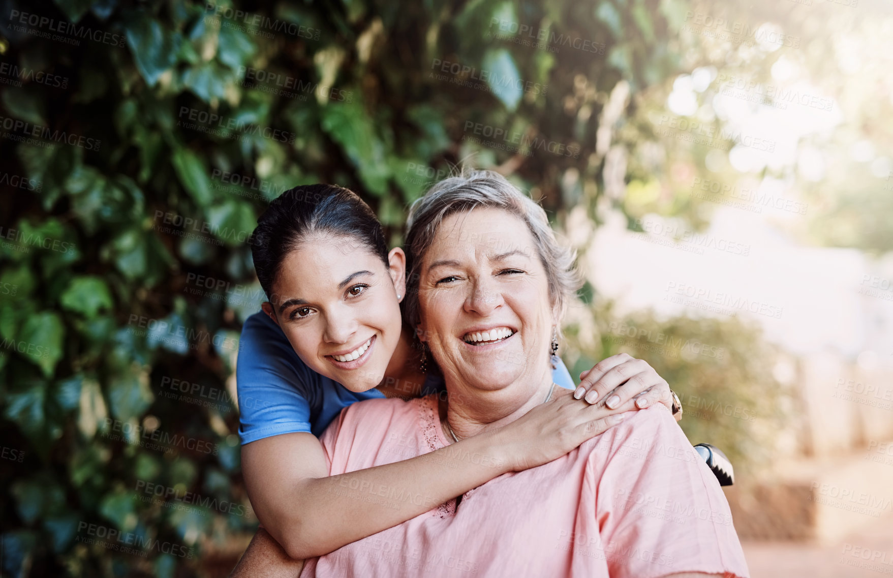 Buy stock photo Retirement, senior woman hugging nurse in portrait for assisted living for person with disability and medical care. Healthcare and women with wheelchair for help, support and rehabilitation in garden