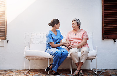 Buy stock photo Full length shot of an attractive young female caregiver chatting to a senior patient outside