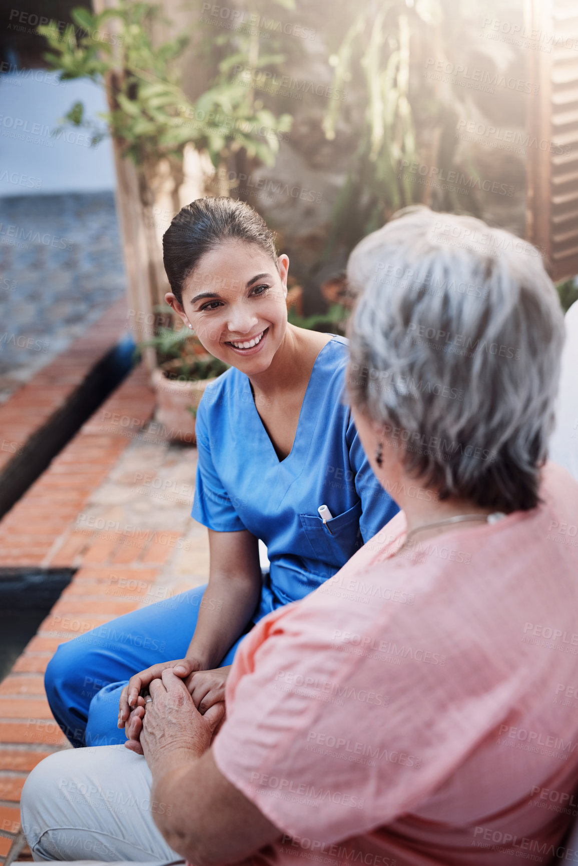 Buy stock photo Holding hands, happy and caregiver with senior woman in garden for therapy, kindness and chat. Mental health, discussion and medical worker or support for retired female person in nursing home 