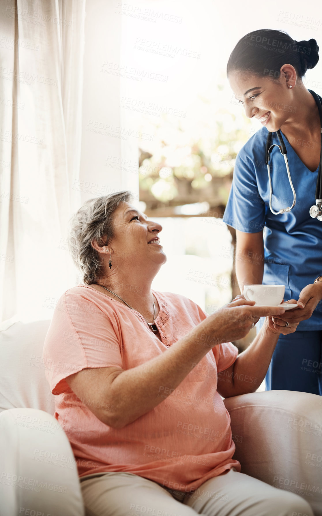 Buy stock photo Caregiver, woman and helping with tea in nursing home for morning, wellness and volunteer of medical support service. Smile, nurse and healthcare with patient espresso for breakfast at elderly care