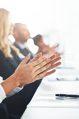 Buy stock photo Cropped shot of a group of unrecognizable businesspeople applauding during a business presentation