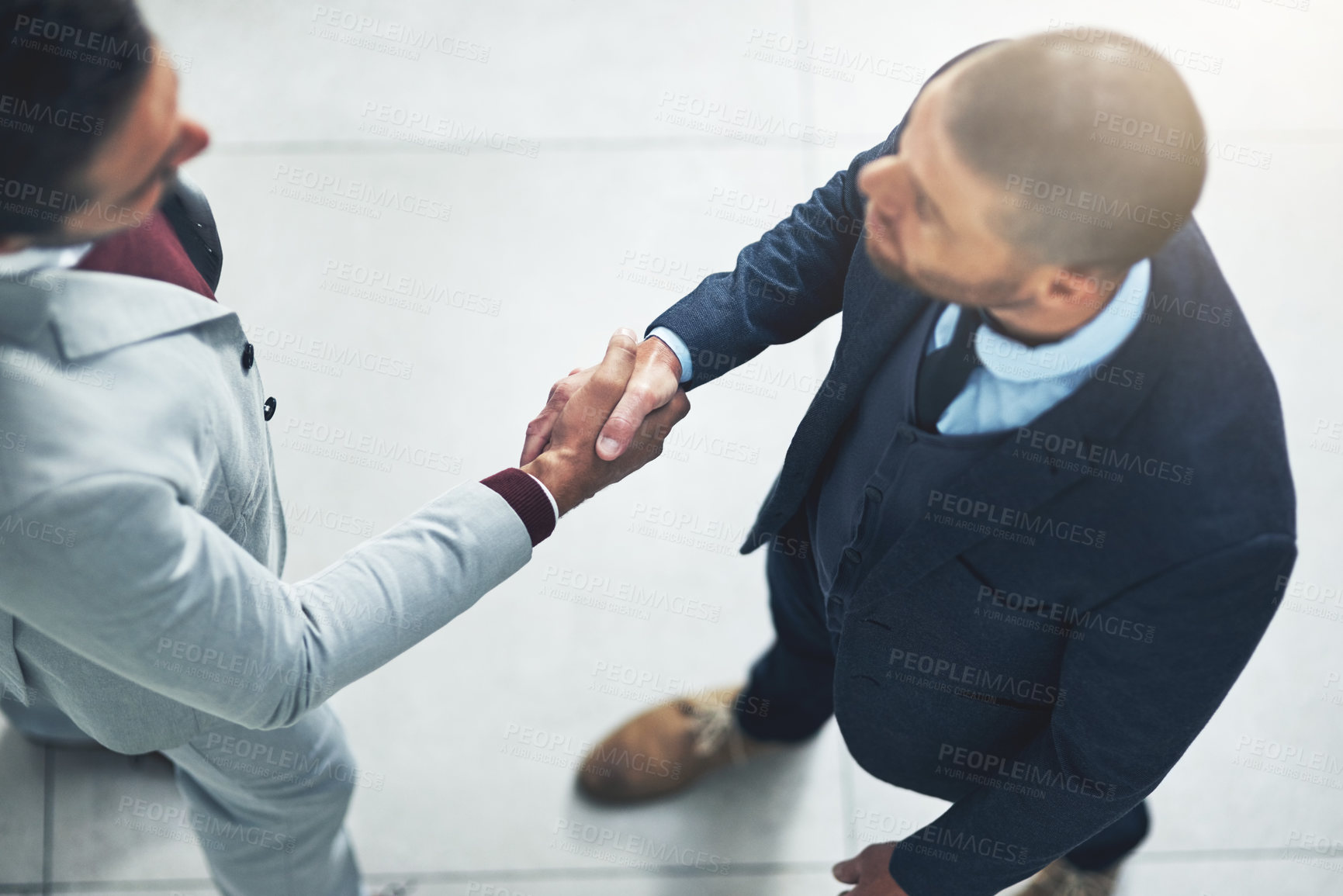 Buy stock photo Top view of business people, greeting or shaking hands for negotiation agreement, investment or b2b deal. Partnership, corporate director or entrepreneur meeting investor for collaboration or support