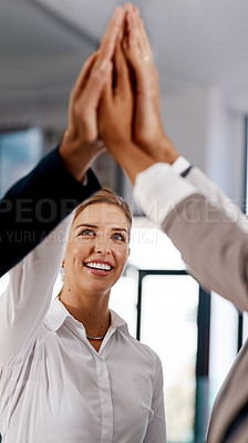 Buy stock photo Shot of a group of businesspeople high fiving together in an office