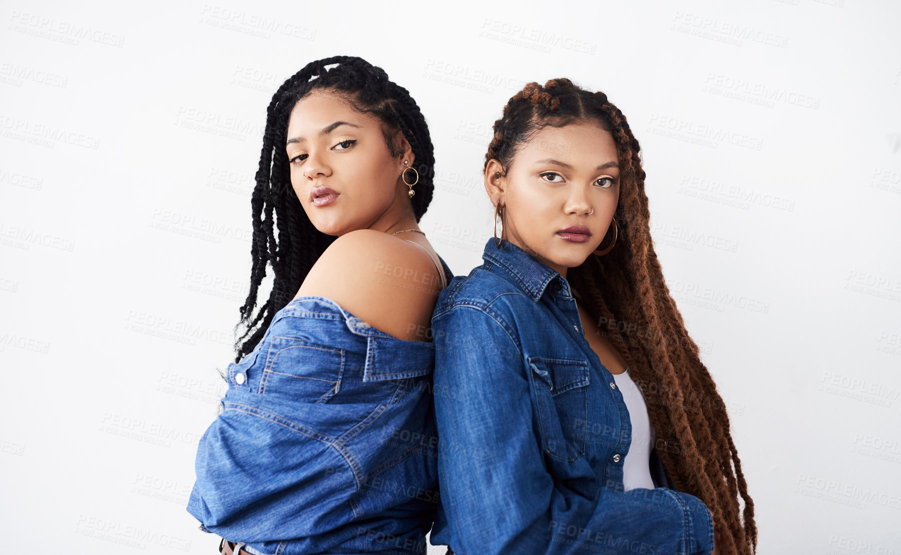 Buy stock photo Portrait, sister and women with fashion in studio with hairstyle, confidence and cool attitude. Face of African people, girl or model with braids and denim for trendy clothes on white background