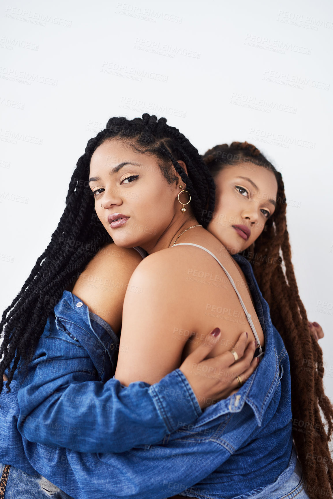 Buy stock photo Portrait, studio and lgbt women with hug, trust or support with gen z partner, pride and denim fashion. Love, solidarity and lesbian couple embrace together with cool trendy style on white background