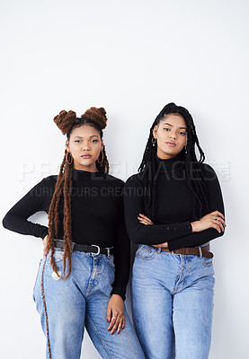 Buy stock photo Sisters, portrait and fashion in studio, confident and style bonding on white background. Women, friends and care for relationship on backdrop, casual outfit and matching trend for gen z or support