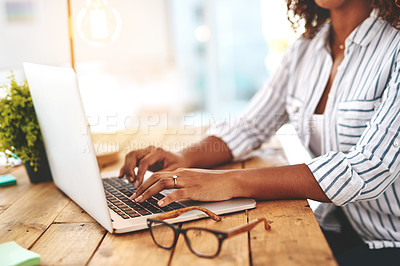 Buy stock photo Closeup of hands typing, writing or replying on laptop while browsing or searching startup business ideas in a cafe. Creative entrepreneur, remote blogger or student with an online blog in restaurant