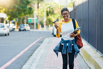 Buy stock photo Cropped shot of a young female student commuting to college in the city
