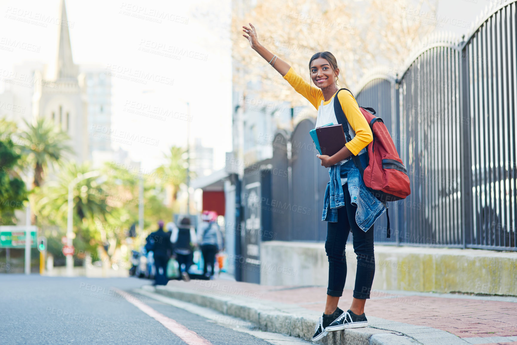 Buy stock photo Shot of a young female student commuting to college in the city