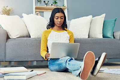 Buy stock photo Student laptop, home living room and woman reading, typing or work on research project, university report or studying. Serious focus, lounge floor and female person learning, education and search web