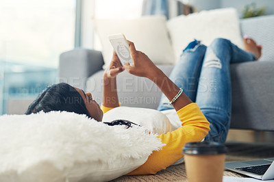 Buy stock photo Lounge floor, cellphone and relax woman typing, texting and search online for home info, media or news blog. Scroll, email and person on smartphone, digital research and message social network user