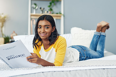 Buy stock photo Shot of a young female student studying at home