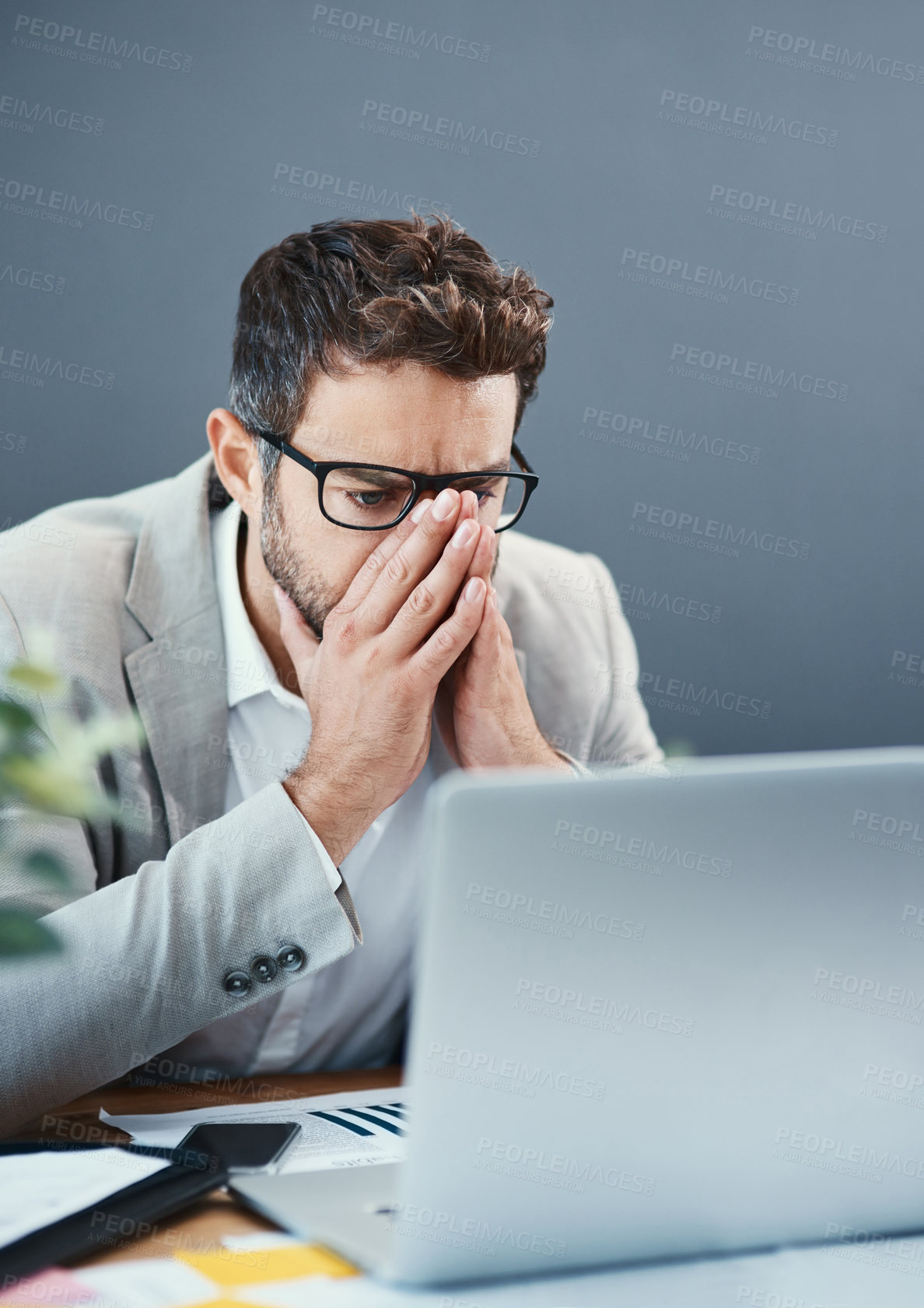 Buy stock photo Man, laptop and reading in office with stress, mistake or thinking with problem solving at insurance agency. Person, computer and glitch at business, crisis or charts with error for stats at company