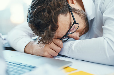 Buy stock photo Overworked, tired and man sleeping on desk with burnout, fatigue and business employee with glasses, papers and laptop sleep in office. Businessman, lawyer and exhausted in company workplace