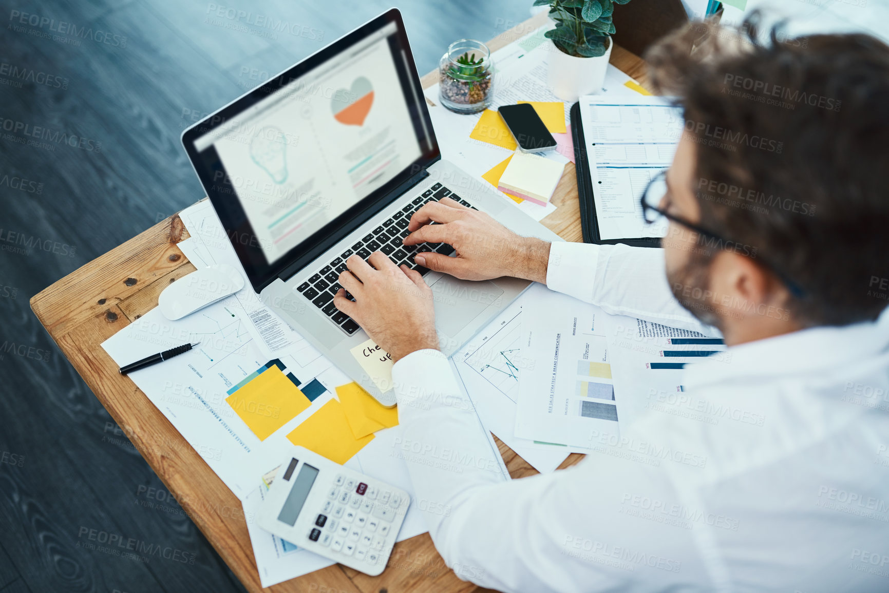 Buy stock photo Businessman, typing and above with laptop or documents for corporate finance, budget or development at office. Top view of man or employee on computer with paperwork for financial planning or content