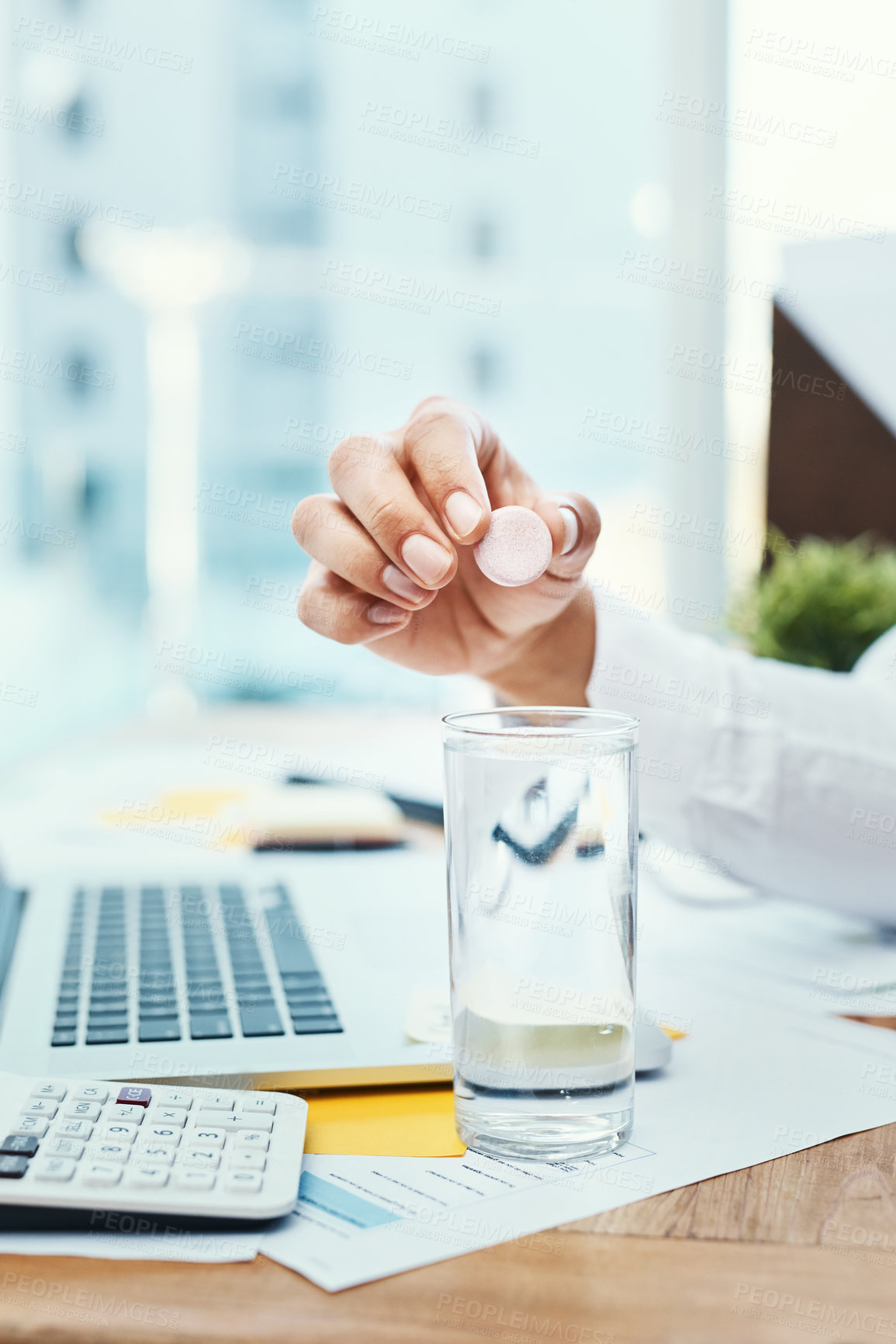 Buy stock photo Businessperson, hands and water with tablet for medication, daily dosage or remedy at office. Closeup of employee with glass of mineral liquid and dissolving pill for pharmaceutical cure at workplace