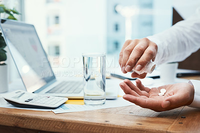 Buy stock photo Shot of an unrecognizable businessman taking medication in an office