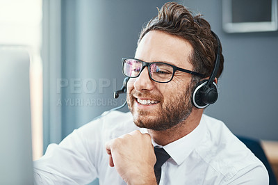 Buy stock photo Shot of a call centre agent working in an office