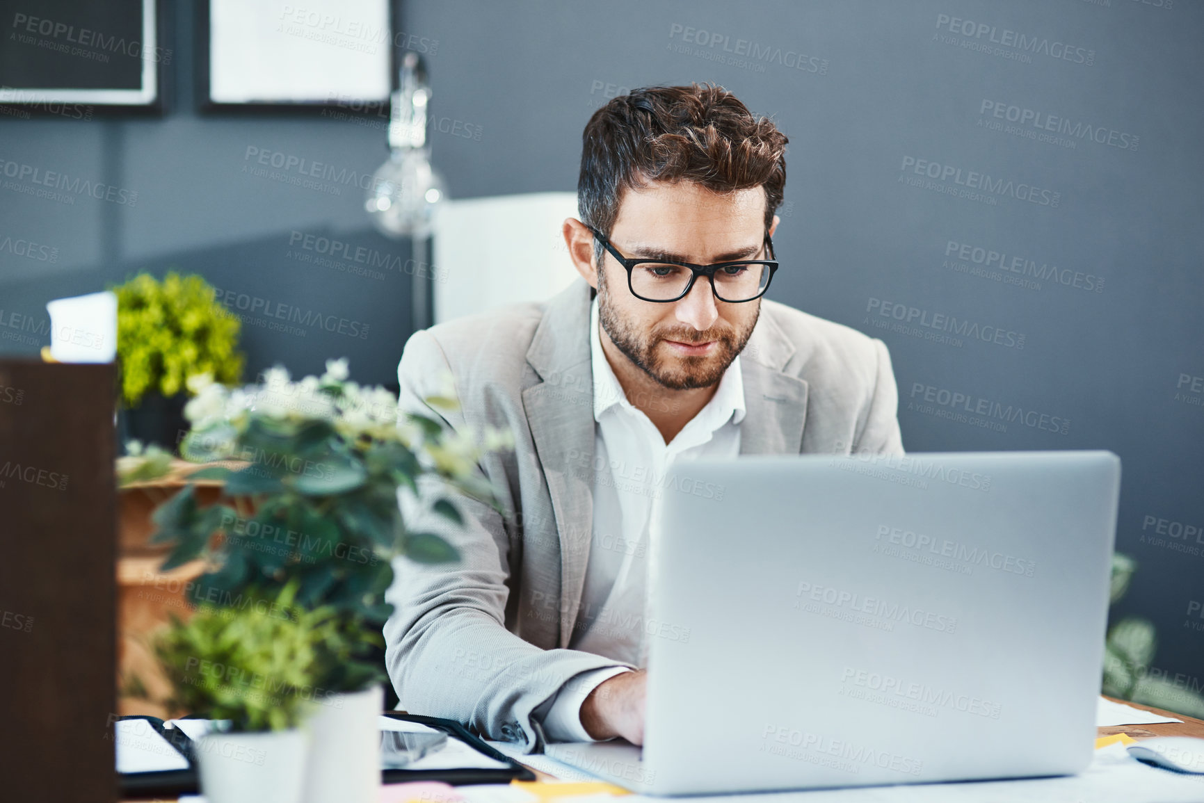 Buy stock photo Corporate, office and businessman with laptop by desk for communication, planning or email update. Lawyer, thinking and internet with tech at law firm for legal case, info or reading client portfolio