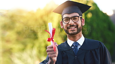 Buy stock photo Portrait of a university student holding his diploma on graduation day