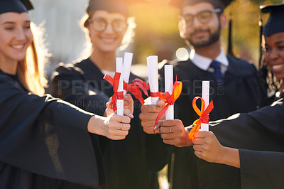 Buy stock photo Group, students and graduation diploma with friends hands of college or university people. Men and women outdoor to celebrate education achievement, success and certificate at school for graduates
