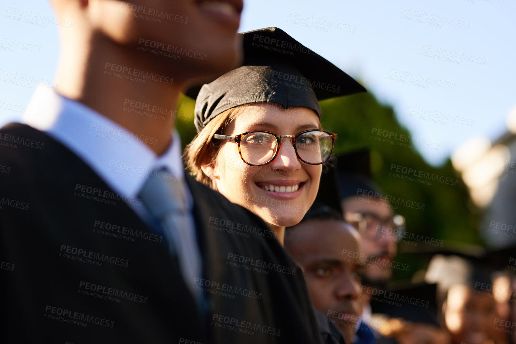 Buy stock photo Graduation, achievement or portrait of happy woman with certificate at university for education or success. College, scholarship or girl with group of people at campus with degree, smile or diploma