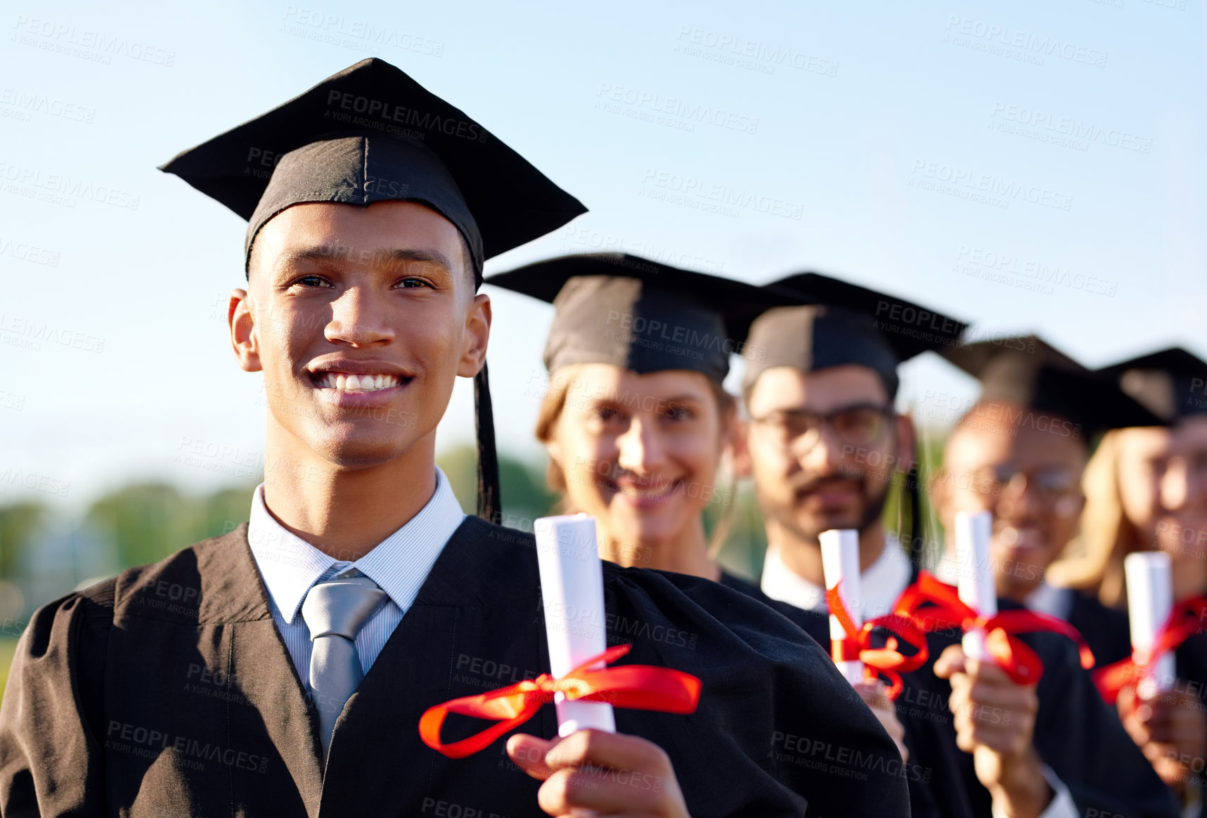 Buy stock photo Happy man, scholar and graduation class with group at ceremony for education, qualification or future. Portrait of person or student with smile for diploma, certificate or study degree on campus