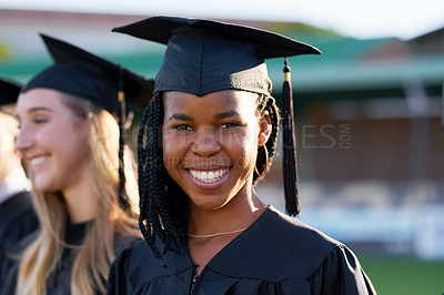 Buy stock photo Happy black woman, student and education with class group at ceremony for graduation, qualification or future. Portrait of person and scholar with smile for diploma, certificate or degree on campus