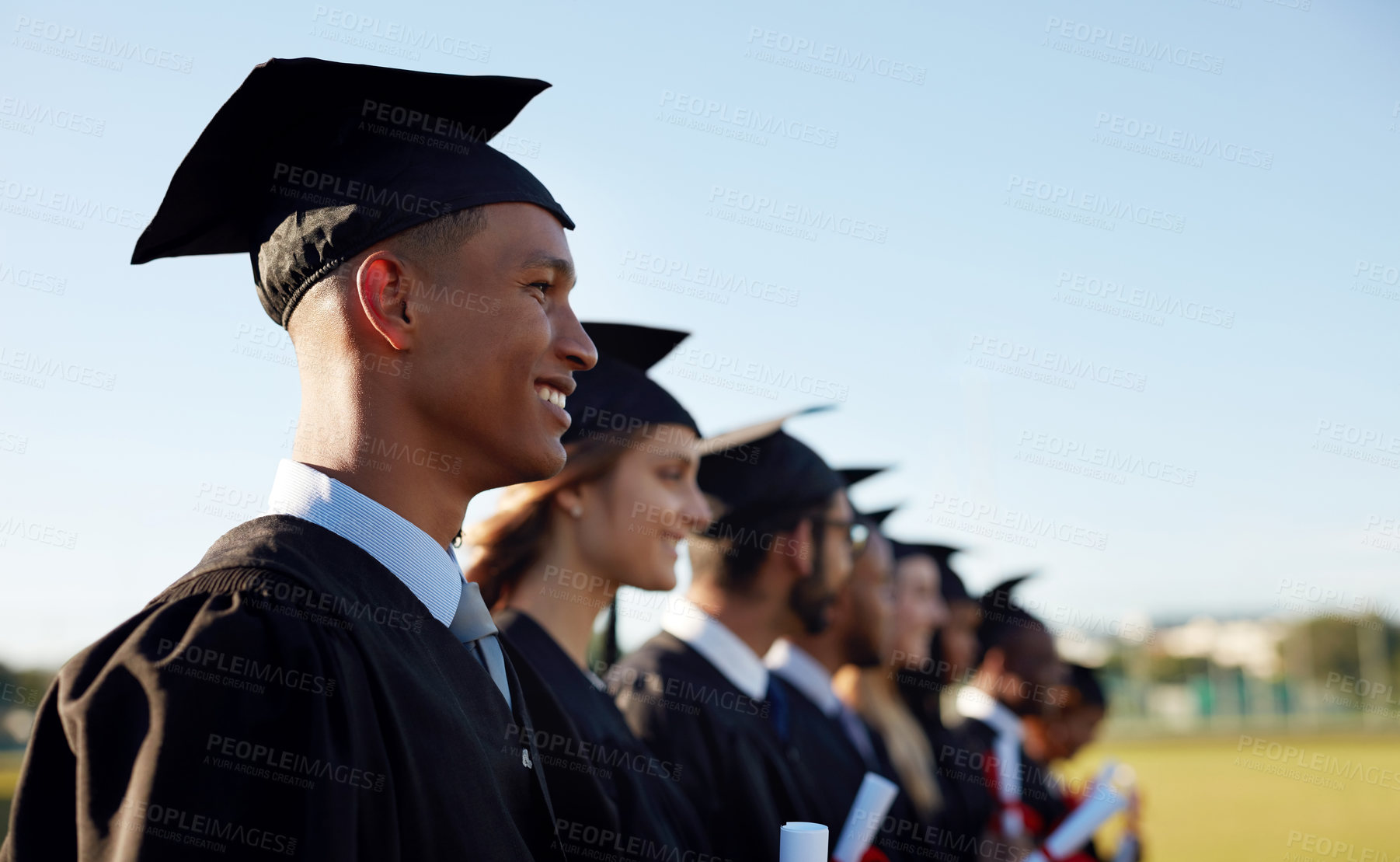 Buy stock photo Happy people, students and graduation with class in line at ceremony for academic achievement or diploma. Young, group or graduates with smile in row together for degree, certificate or qualification