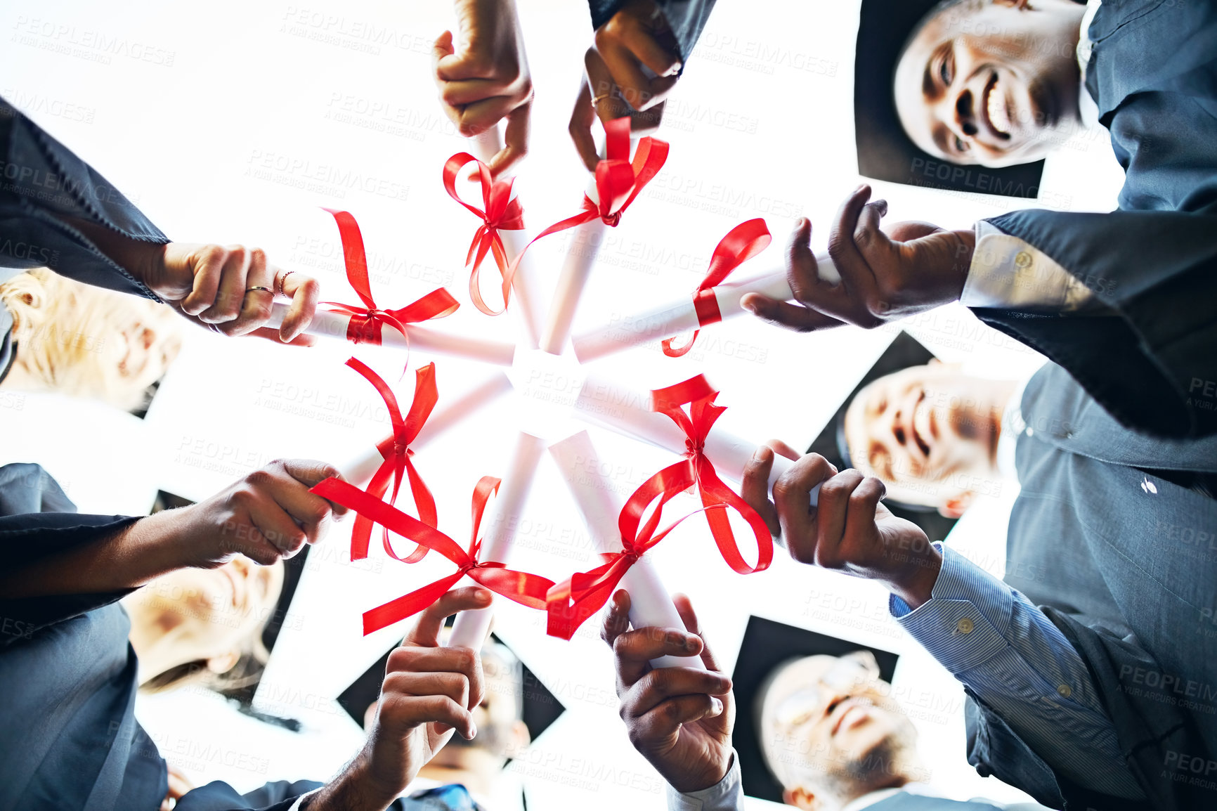 Buy stock photo Hands, certificate and people in circle at graduation together with support, solidarity and achievement at college. University, community and students in huddle with education diploma in low angle