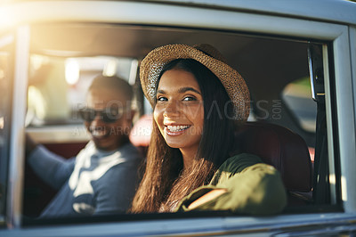 Buy stock photo Shot of a female passenger enjoying a road trip